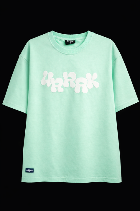 Mint green Urrak t-shirt with white floral design on a black background