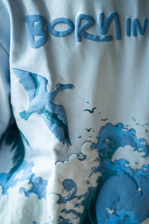 Born in Goa Sand and Sea puff print oversized t-shirt (Pale Blue)